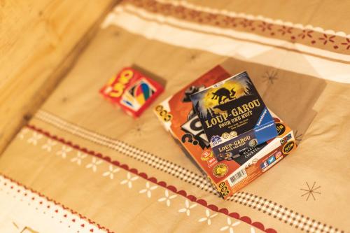 a package of food on top of a bed at Le Rioumajou 1 - Grand T6 - Piscine - Centre St Lary in Saint-Lary-Soulan
