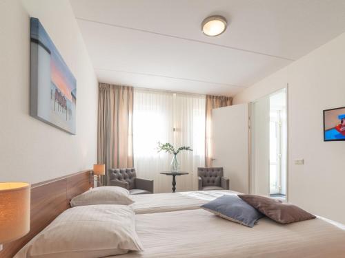 Ένα ή περισσότερα κρεβάτια σε δωμάτιο στο Holiday Home Ganuenta-1 by Interhome