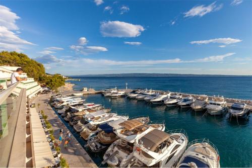 a bunch of boats docked in a marina at Santa Barbara in Podstrana