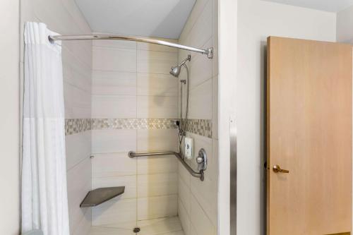 a bathroom with a shower with a shower curtain at Comfort Inn & Suites Susanville in Susanville