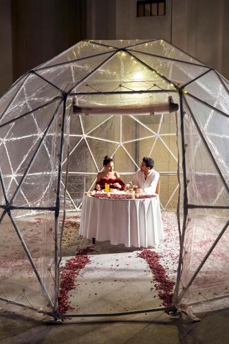 a group of people sitting at a table in a tent at Palma Hotel in Port Said