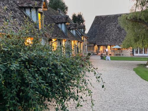 a large house with a hedge in front of it at Commanderie de Bourgoult in Harquency