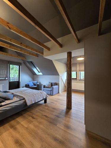 a bedroom with a bed and a living room at PUTNI Resort in Laukbeitini