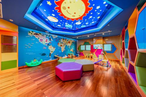 a childrens room with a mural of the earth and the moon at Sherwood Suites in Ho Chi Minh City