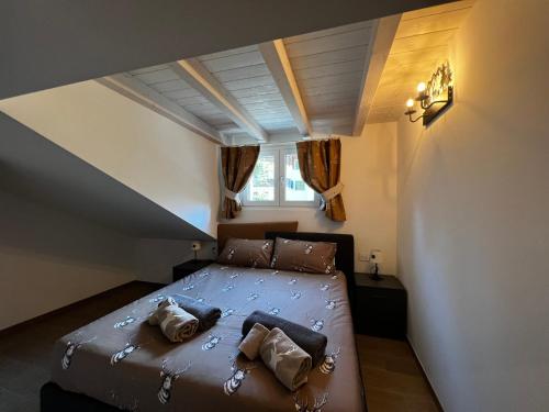 Ένα ή περισσότερα κρεβάτια σε δωμάτιο στο Chalet Chiara apricacasevacanze