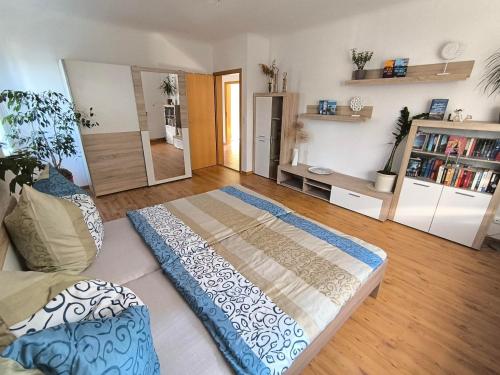 a bedroom with a large bed in a room at Ferienwohnung "Spatzennest" in Pirna