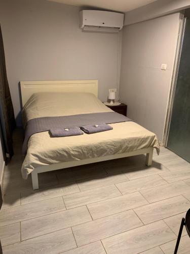 a bedroom with a bed with two towels on it at avraham B''H in Nevatim