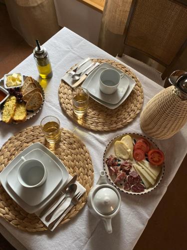 a table with plates of food on top of it at El Encanto de Bustares in Bustares