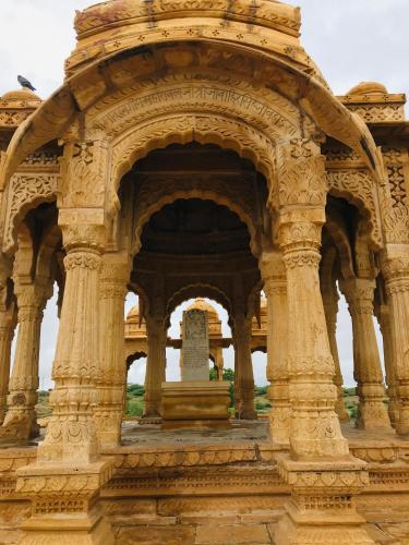 an old building with an arch in an indian at Blue Eye Hostel in Jaisalmer