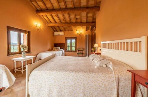 a bedroom with a large bed in a room at Agriturimo Cà Dorale in Fano