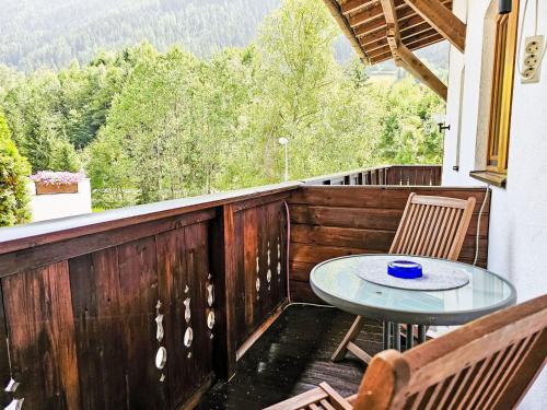 a patio with a table and chairs on a balcony at Apartment Inn by Interhome in See
