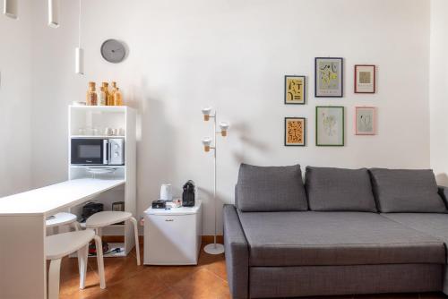 a living room with a couch and a table at La Casetta in Rome