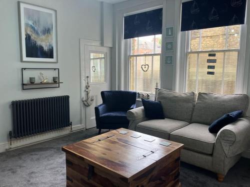 a living room with a couch and a coffee table at Crown Cove in Pakefield
