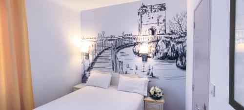 Ein Bett oder Betten in einem Zimmer der Unterkunft Logis VIGNES BLANCHES*** Hôtel Cosy et restaurant de terroir