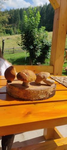 a group of mushrooms sitting on a wooden table at Садиба Кичера in Petrashani
