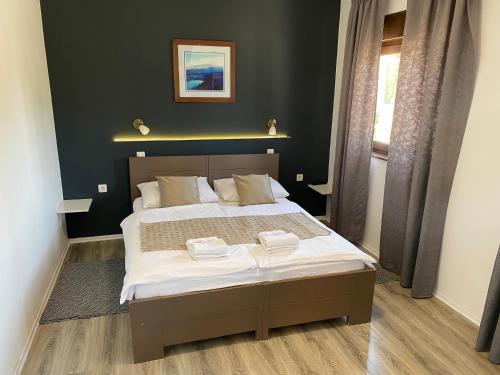 Postel nebo postele na pokoji v ubytování 16 Lakes Guesthouse