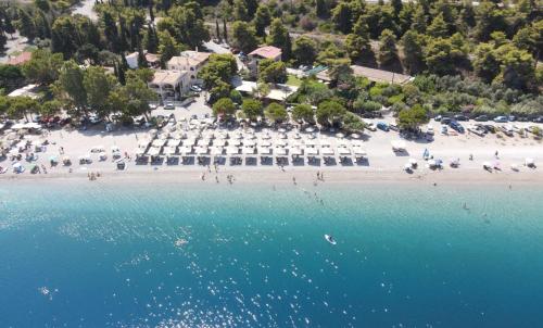 an aerial view of a beach with chairs and umbrellas at Sea & Mountain Horizon by Myrto in Diakopto