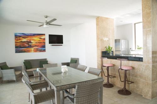 a dining room with a table and chairs at San Bruno TROPICAL Villa With POOL in San Bruno