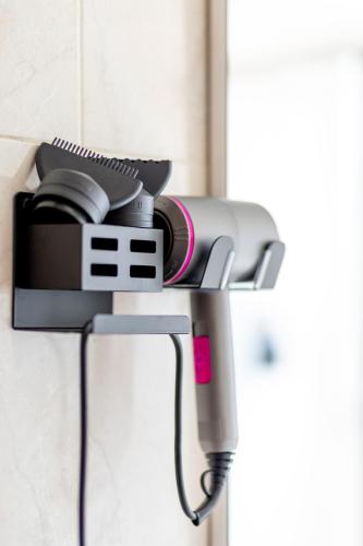 a camera hanging on a wall at Cinnamon LakeHouse in Cavalcaselle
