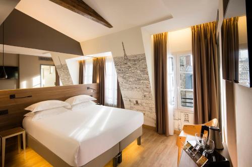Ένα ή περισσότερα κρεβάτια σε δωμάτιο στο Cler Hotel