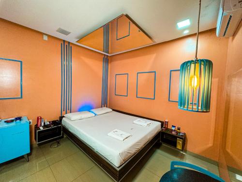 Een bed of bedden in een kamer bij Rodotel Vênus Prime