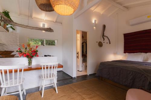 Katil atau katil-katil dalam bilik di Oka Maraú I Charming Bungalows