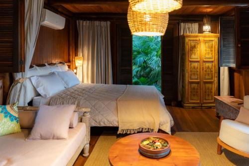 Katil atau katil-katil dalam bilik di Oka Maraú I Charming Bungalows