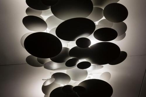 a bunch of black and white spheres on a ceiling at Cler Hotel in Paris
