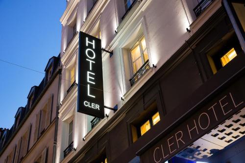 a large building with a sign on the side of it at Cler Hotel in Paris
