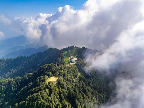 an aerial view of a house on top of a mountain at Zostel Kotgarh, Narkanda in Kotgarh