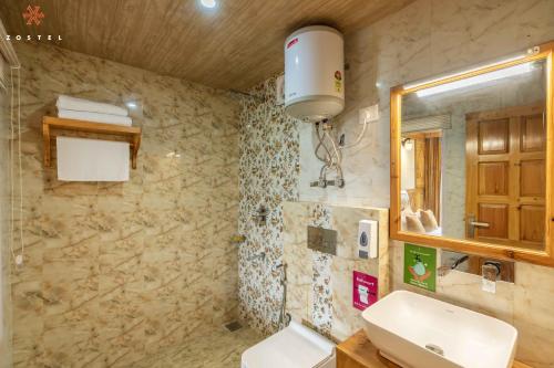 a bathroom with a sink and a mirror at Zostel Kotgarh, Narkanda in Kotgarh