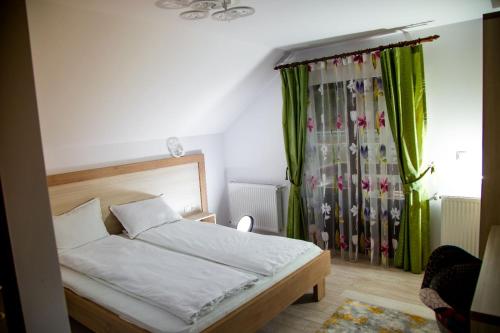 Ένα ή περισσότερα κρεβάτια σε δωμάτιο στο Casa Agnes