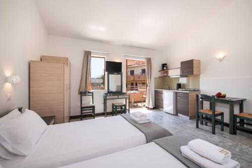 Ένα ή περισσότερα κρεβάτια σε δωμάτιο στο Eko Suites