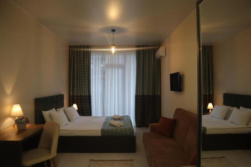 Postel nebo postele na pokoji v ubytování Horizons Hotel Rooms