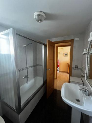 a bathroom with a shower and a sink at Bacarola in Los Mártires
