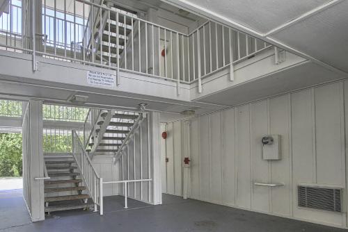 a hallway with a staircase in a building at Motel 6-New Cumberland, PA - Harrisburg - Hershey South in New Cumberland
