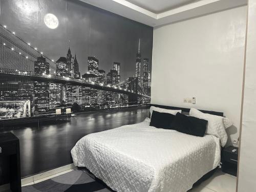 a bedroom with a bed with a view of a city at Luxury 2- Apartment Furnished luxury residence in Cocody