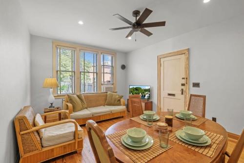 a living room with a table and a couch at The Urban Oasis - 2 BR - Great Location in Columbus