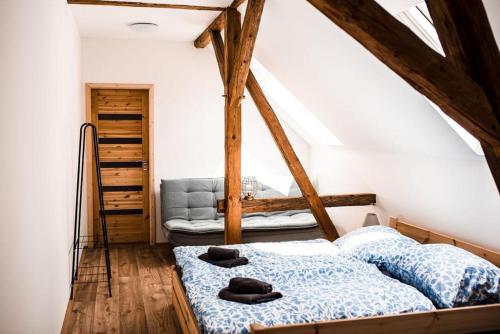a bedroom with two beds in a attic at Řasnická stodola in Horní Řasnice