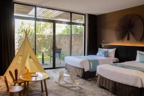 Postel nebo postele na pokoji v ubytování Melia Danang Beach Resort