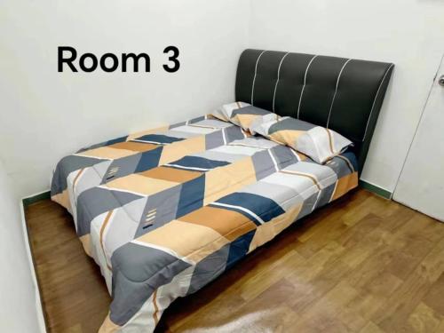 a bed in a bedroom with a room sign at 390 Kurau in Kuala Kurau