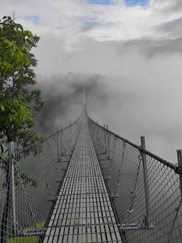 a suspension bridge in the middle of the sky at Homestay in Baglung Bazar -Baglung Homestay in Bāglung