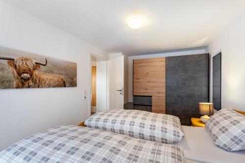 Postel nebo postele na pokoji v ubytování Ferienhaus Doris