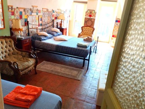 a bedroom with two beds and a table and chairs at Maya : casa rustica con vista panoramica in Narni