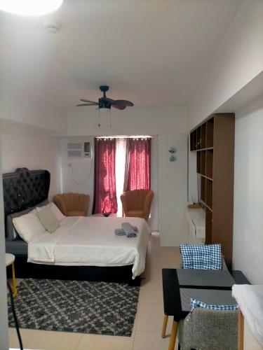 a bedroom with a bed and a couch at Avida Towers Riala, Tower 2 in Cebu City