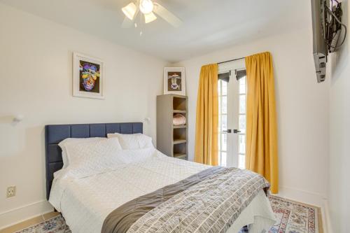 a bedroom with a blue and white bed and a window at Chic New Orleans Abode 1 Mi to Lake Pontchartrain in New Orleans