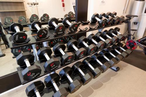 a row of dumbbells in a gym at Hilton Saint Augustine Historic Bayfront in Saint Augustine