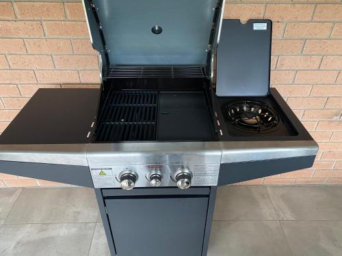 a stove top oven sitting on top of a counter at Tranquility in Oberon