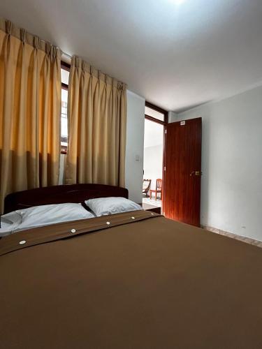 Ένα ή περισσότερα κρεβάτια σε δωμάτιο στο Hostal El Gran Gocta