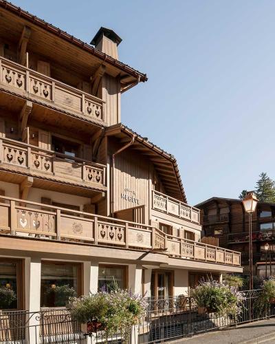 a building with balconies on the side of it at Coeur de Megève in Megève